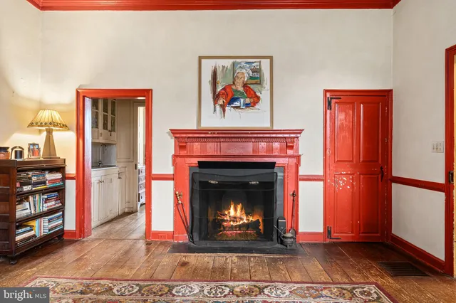 a view of a patio with a table and chairs under an umbrella