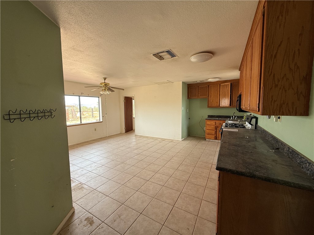 3443 3rd Street Inyokern, CA 93527 - Photo 11 of 25 a view of a kitchen with a sink and cabinets