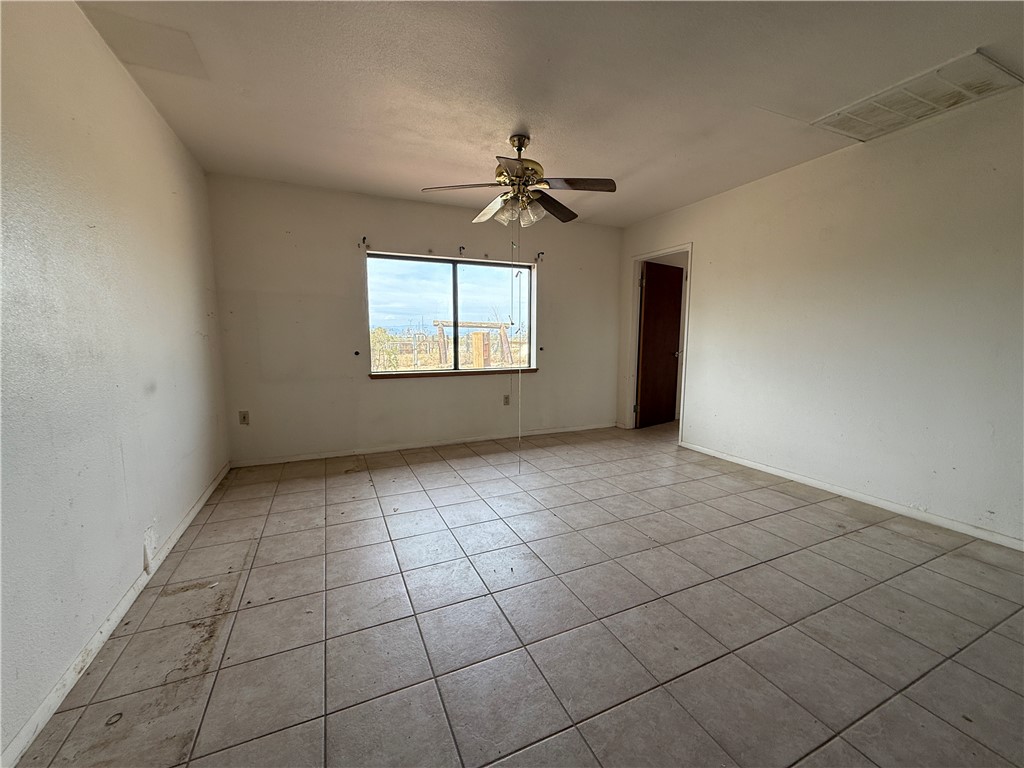 3443 3rd Street Inyokern, CA 93527 - Photo 16 of 25 an empty room with windows and ceiling fan