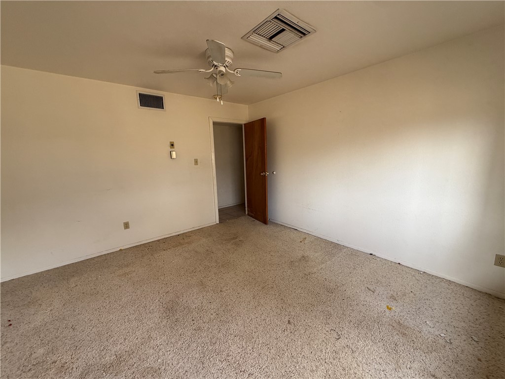3443 3rd Street Inyokern, CA 93527 - Photo 19 of 25 en empty room with windows and ceiling fan