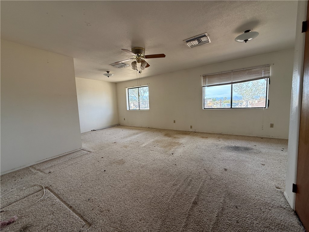 3443 3rd Street Inyokern, CA 93527 - Photo 22 of 25 a view of room with a ceiling fan and window