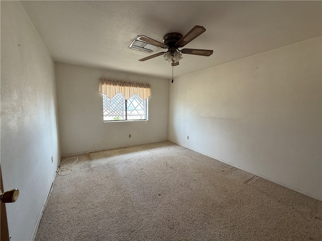 3443 3rd Street Inyokern, CA 93527 - Photo 24 of 25 an empty room with a window and a fan