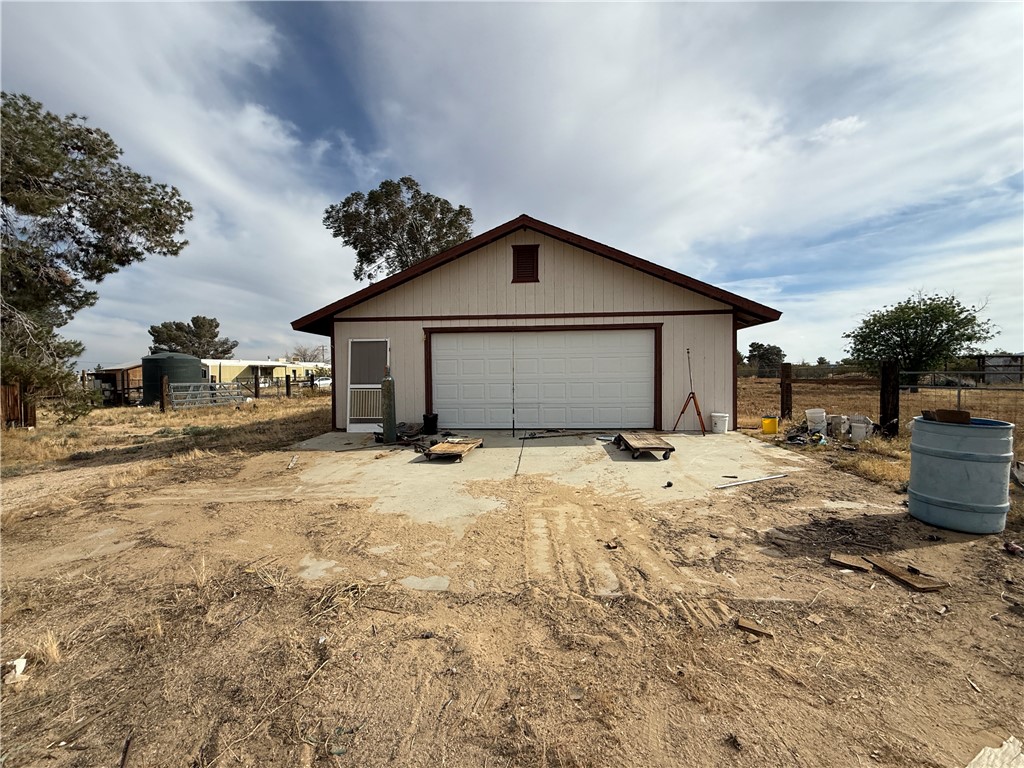 3443 3rd Street Inyokern, CA 93527 - Photo 6 of 25 a view of a house with a yard and seating area