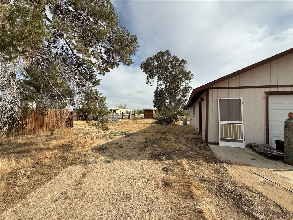3443 3rd Street Inyokern, CA 93527 - Photo 7 of 25 a view of a house with a yard covered in snow