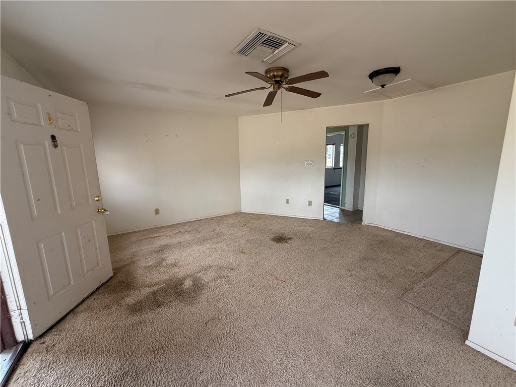 3443 3rd Street Inyokern, CA 93527 - Photo 8 of 25 an empty room with a empty space and a ceiling fan