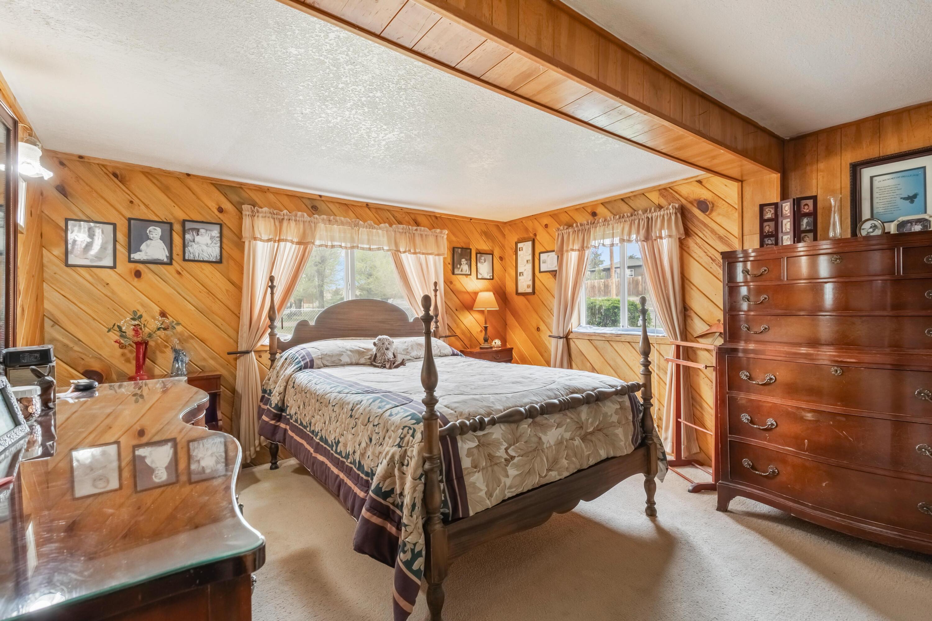 2010 Northeast Laughlin Road Prineville, OR 97754 - Photo 12 of 39 a bed sitting in a bedroom next to a window