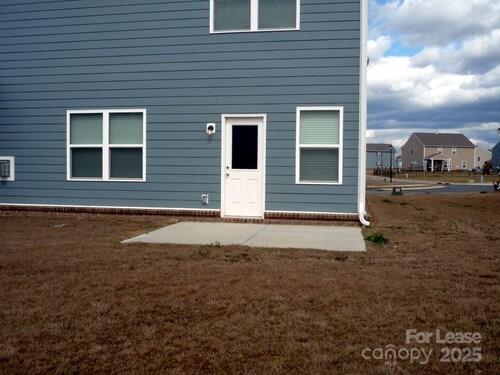 1003 Blue Stream Lane Indian Trail, NC 28079 - Photo 15 of 18 a front view of a house with a yard