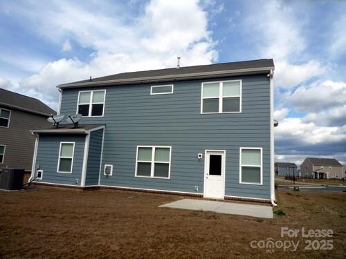 1003 Blue Stream Lane Indian Trail, NC 28079 - Photo 16 of 18 a front view of a house with a yard