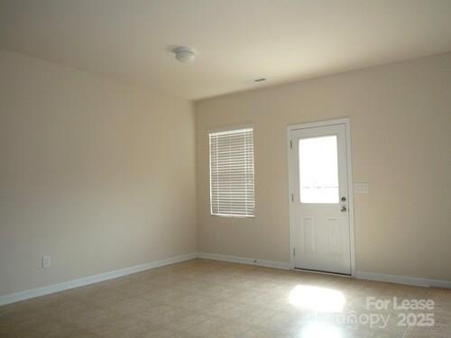 1003 Blue Stream Lane Indian Trail, NC 28079 - Photo 5 of 18 an empty room with windows