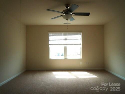 1003 Blue Stream Lane Indian Trail, NC 28079 - Photo 10 of 18 an empty room with a window and a fan