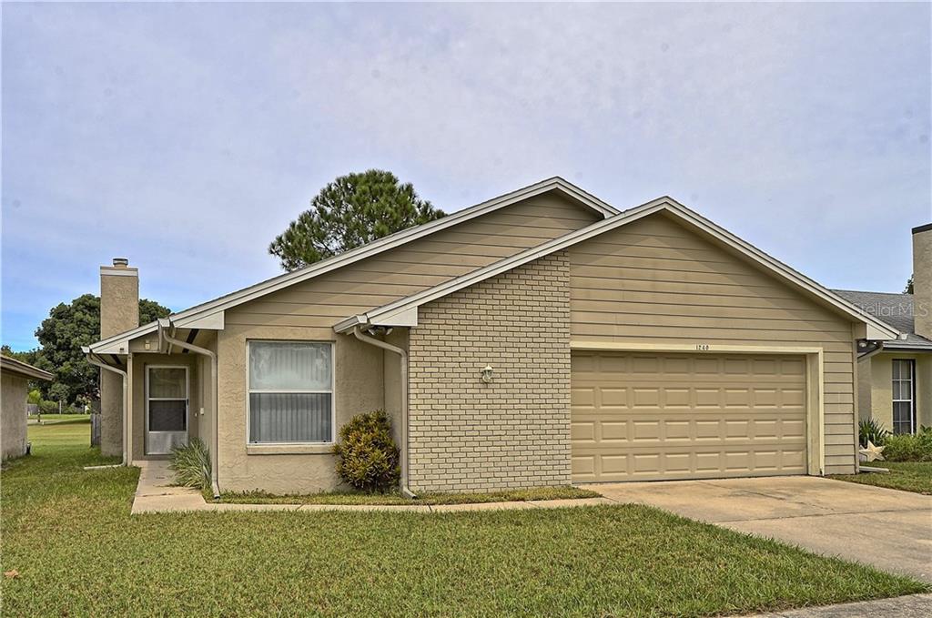 1240 Rising Sun Boulevard Winter Springs, FL 32708 - Photo 1 of 1 a front view of a house with a yard