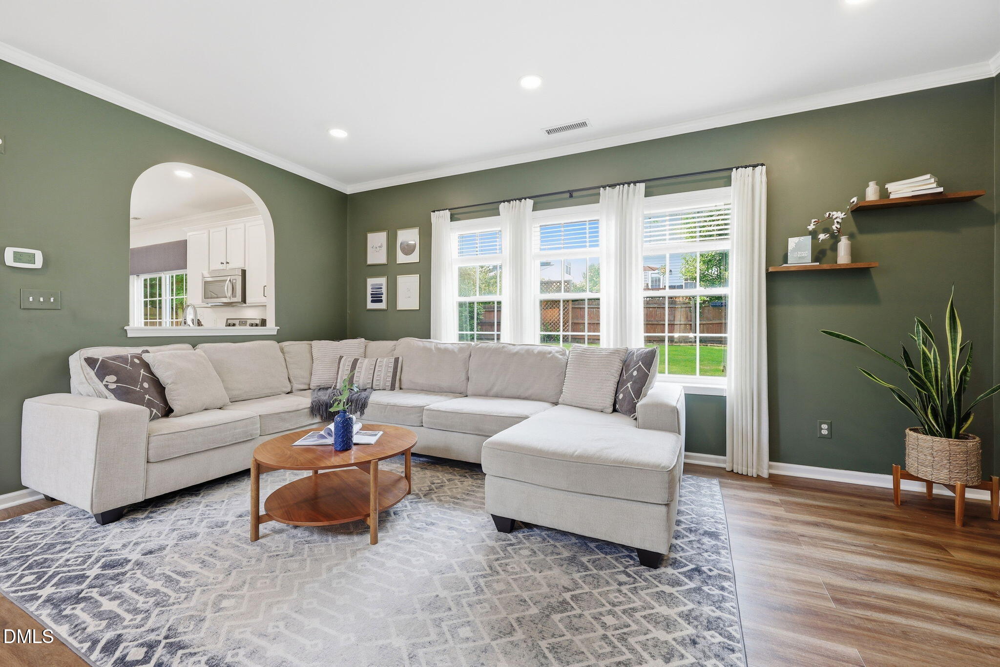 5629 Enoree Lane Raleigh, NC 27616 - Photo 8 of 38 a living room with furniture and a potted plant
