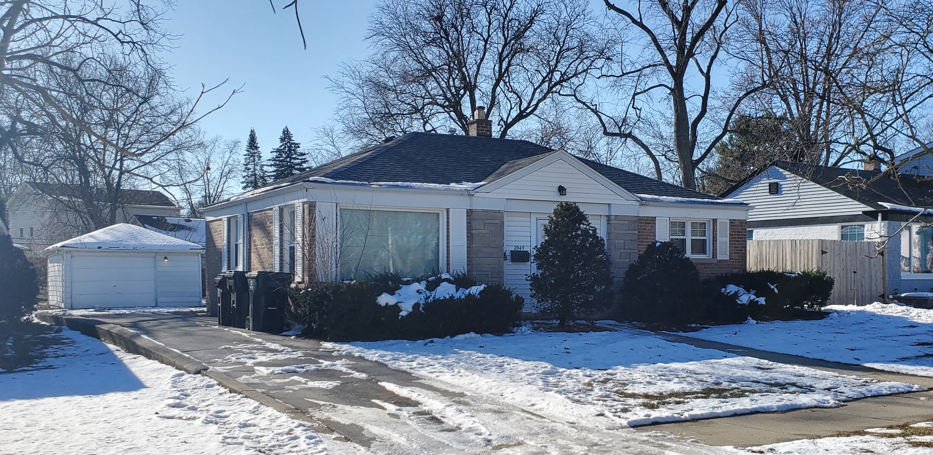 2049 Magnolia Road Homewood, IL 60430 - Photo 2 of 10 a front view of a house with garden