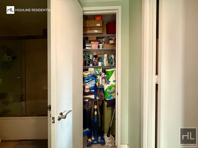 a bathroom with a shower and a sink