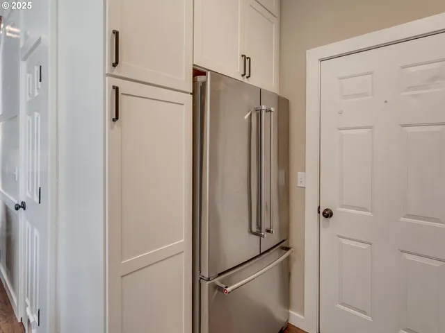 a bathroom with a shower and a glass door