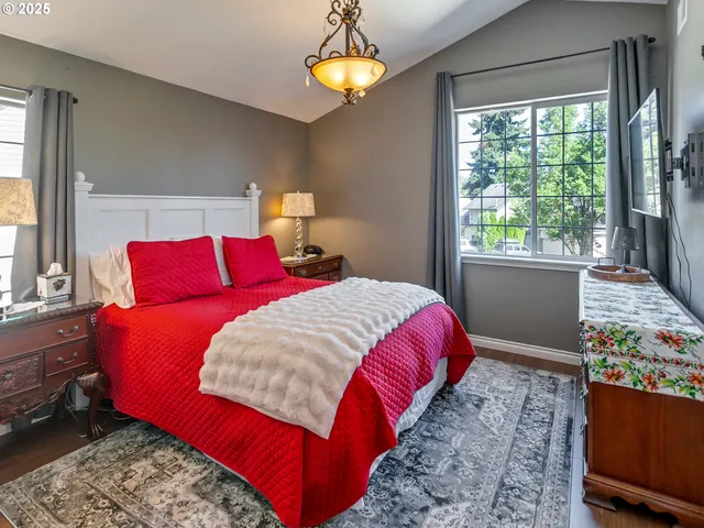 a bed room with a bed and a window