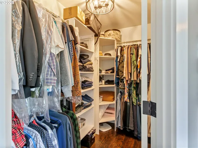a spacious bedroom with a bed and a window