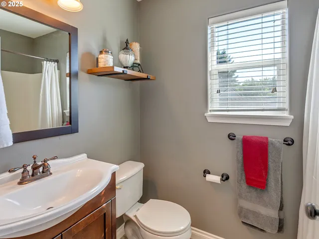 a bedroom with bed and a window