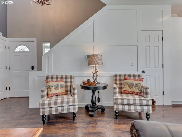 a bedroom with furniture and a chandelier