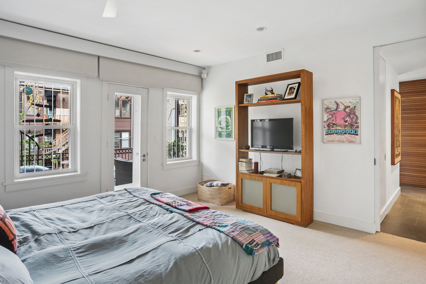 710 West Junior Terrace, Unit 2 Chicago, IL 60613 - Photo 17 of 37 a bedroom with a bed and a flat screen tv