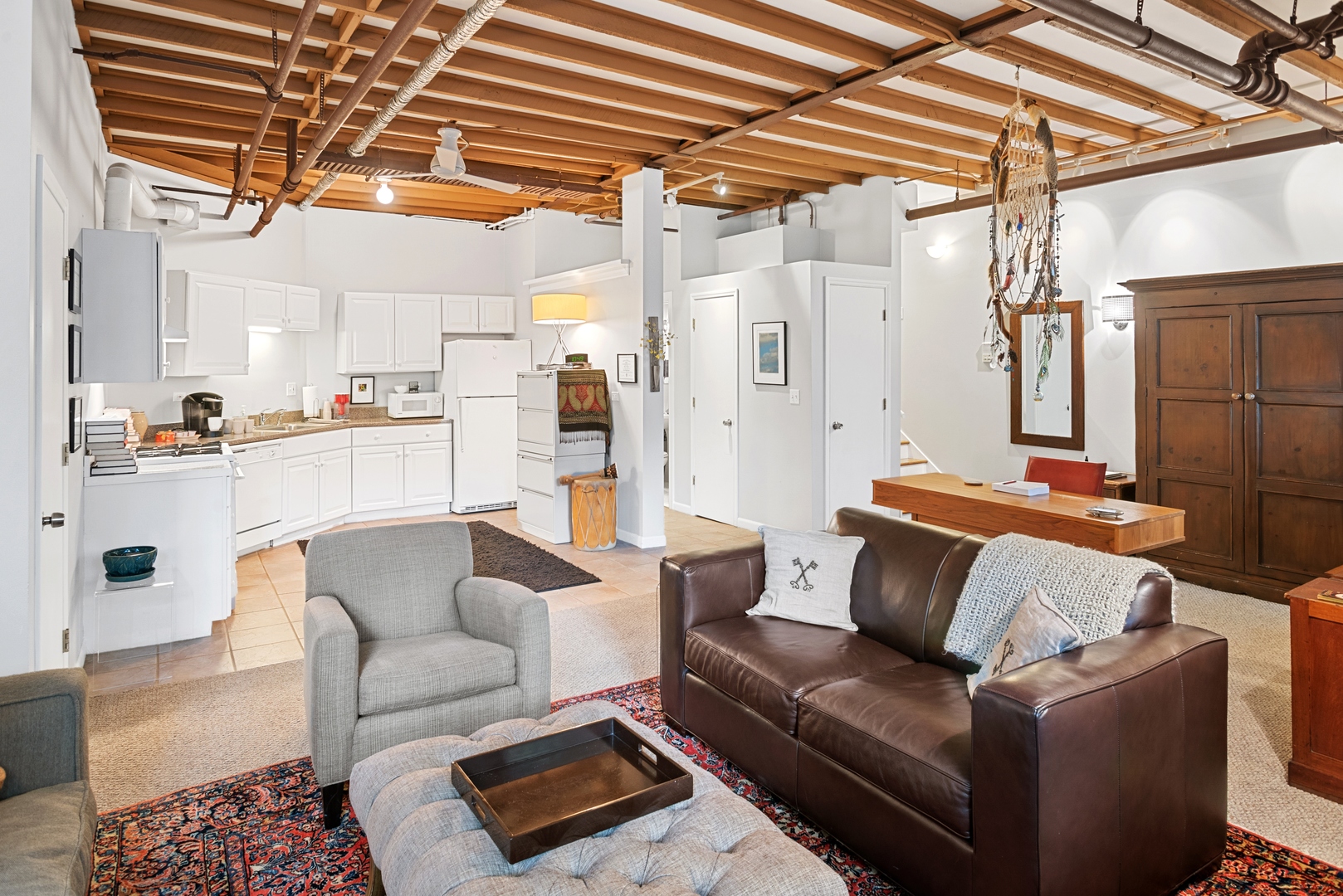 710 West Junior Terrace, Unit 2 Chicago, IL 60613 - Photo 33 of 37 a living room with furniture and a chandelier