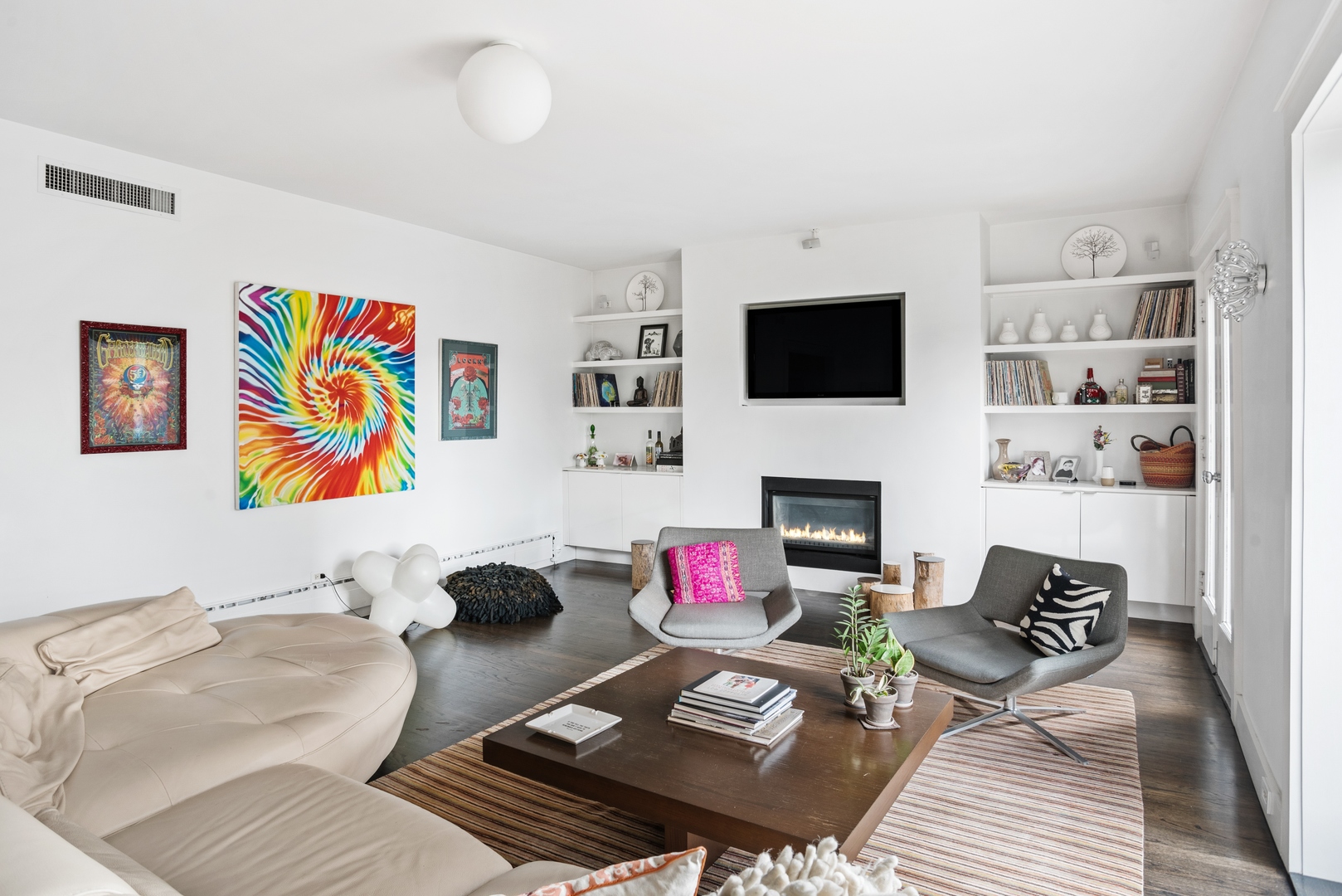 710 West Junior Terrace, Unit 2 Chicago, IL 60613 - Photo 5 of 37 a living room with fireplace furniture and a flat screen tv