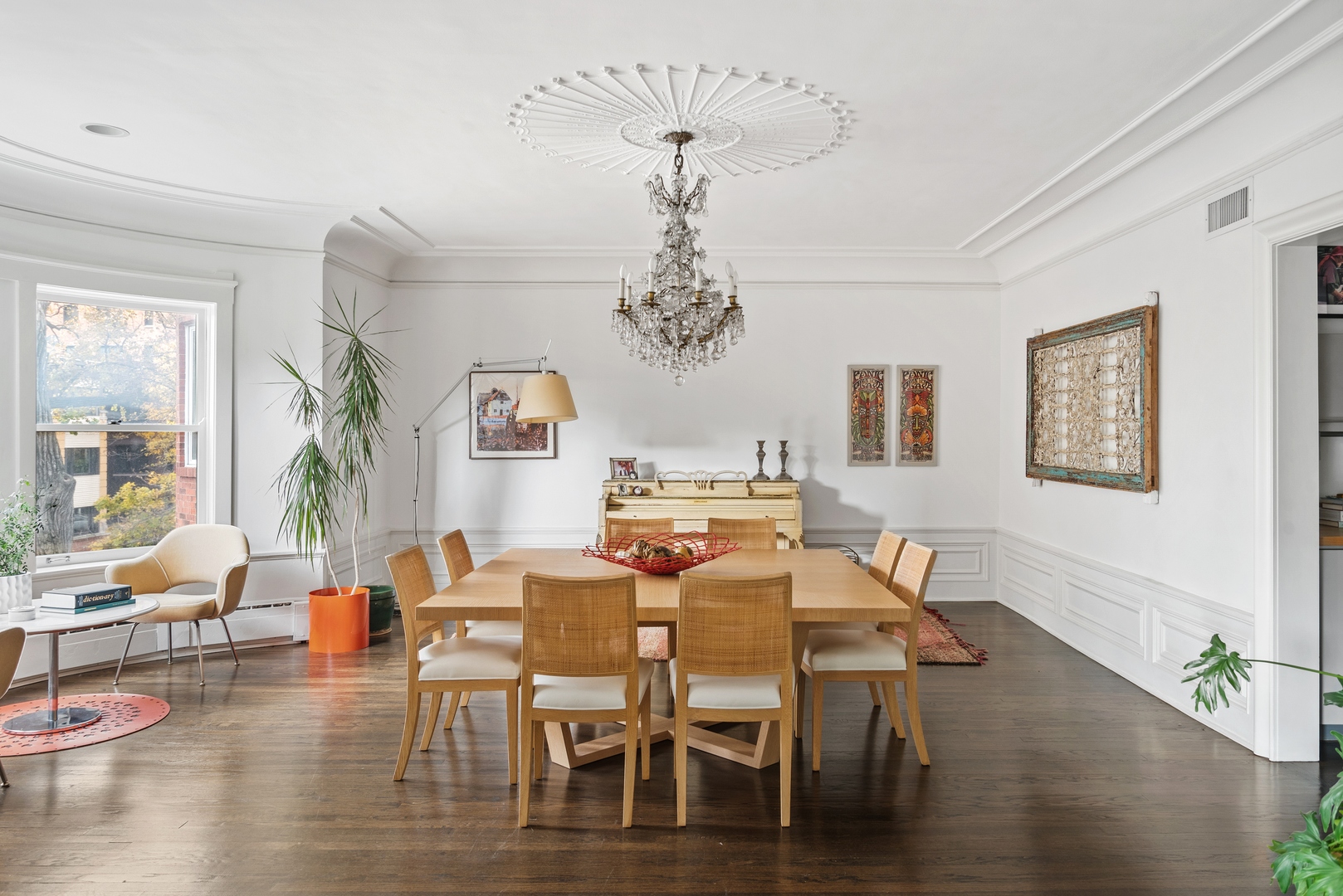 710 West Junior Terrace, Unit 2 Chicago, IL 60613 - Photo 7 of 37 a view of a dining room with furniture wooden floor and chandelier