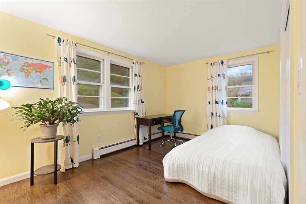 33 Longmeadow Lane Sharon, MA 02067 - Photo 13 of 29 a bedroom with a bed and a table