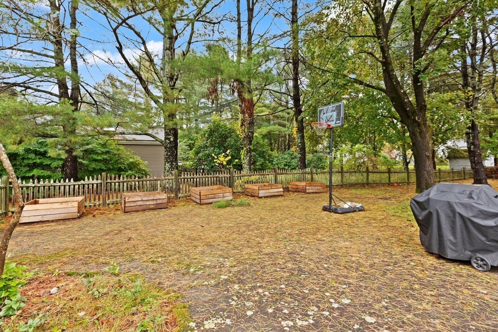 33 Longmeadow Lane Sharon, MA 02067 - Photo 24 of 29 a view of a park with swings and a trees