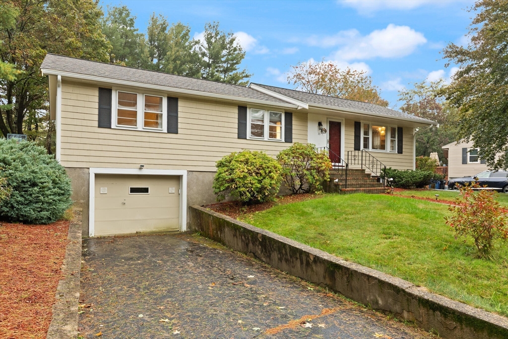 33 Longmeadow Lane Sharon, MA 02067 - Photo 3 of 29 a front view of a house with a garden