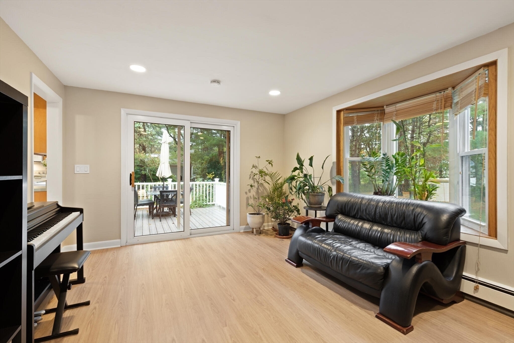 33 Longmeadow Lane Sharon, MA 02067 - Photo 9 of 29 a living room with furniture and a flat screen tv