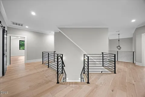 a view of an empty room with a kitchen