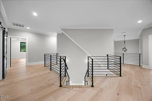a view of an empty room with a kitchen