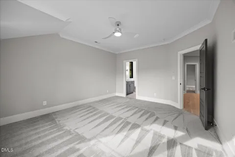 a bedroom with a bed window and couch