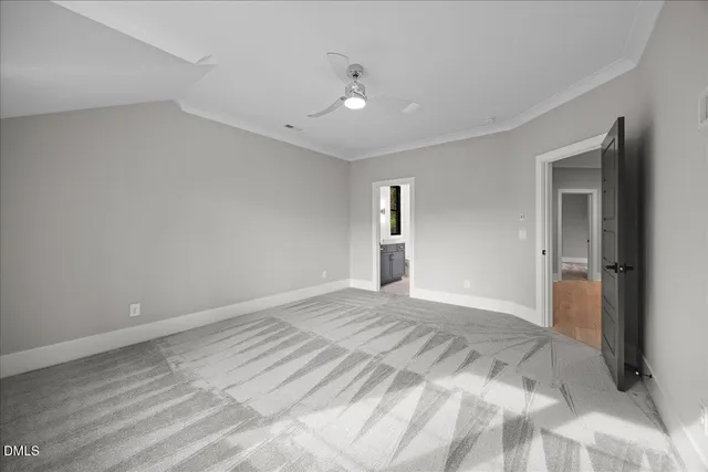 a bedroom with a bed window and couch