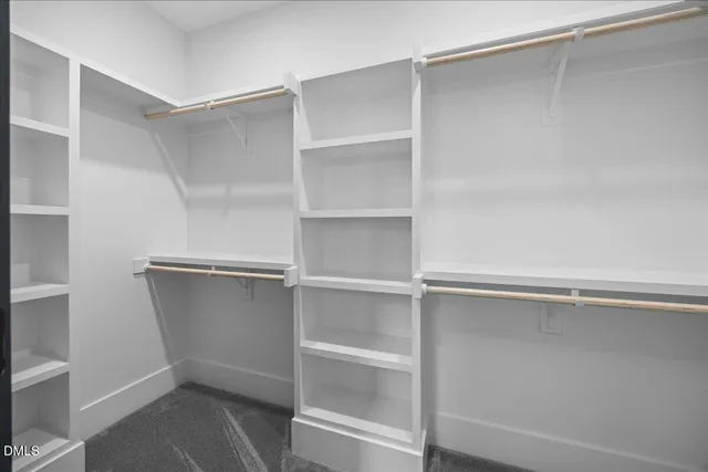 a bedroom with a bed and a table