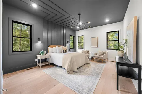 a front view of a house with a yard table and chairs