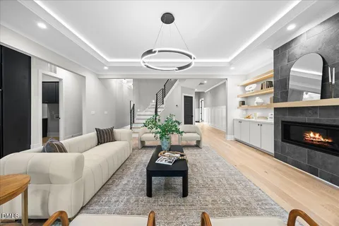 a living room with furniture and a fireplace