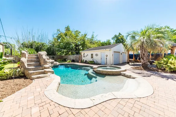 a view of a swimming pool with a patio