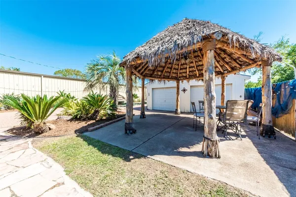 a view of a backyard with a patio