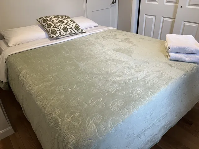 a vase of flowers sitting on a floor