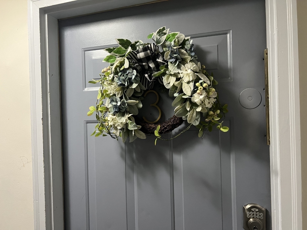 35 Grove Street, Unit 3 Boston, MA 02114 - Photo 16 of 20 a vase of flowers sitting on a floor