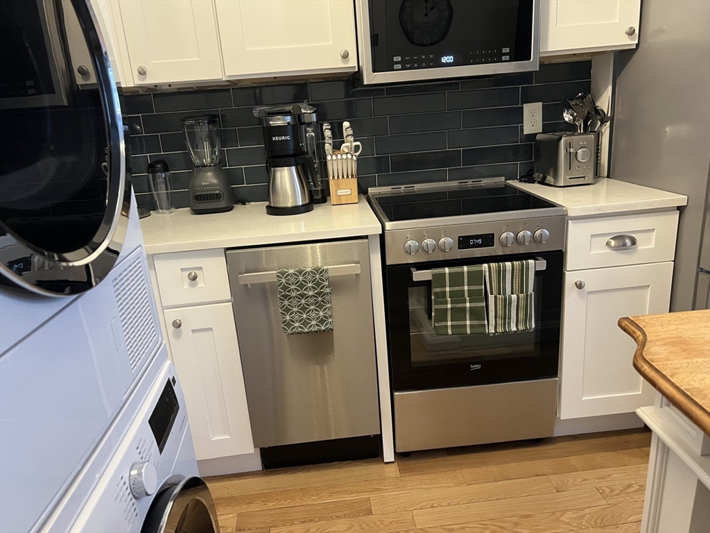 35 Grove Street, Unit 3 Boston, MA 02114 - Photo 2 of 20 a close view of washer and dryer