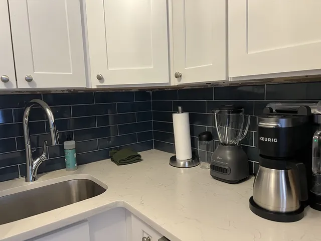 a kitchen with a sink and a window