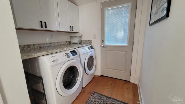 a view of a kitchen with washer and dryer