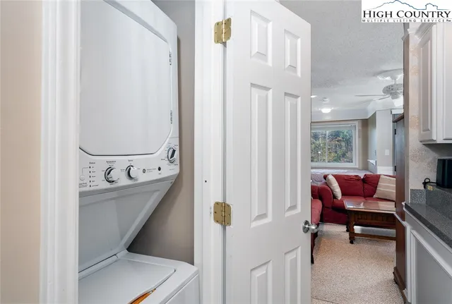 a view of a hallway with seating area