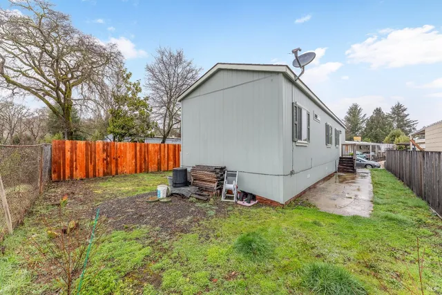 a view of backyard with small cabin