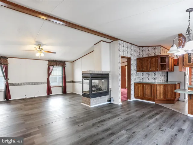 a view of a livingroom with furniture and a fireplace