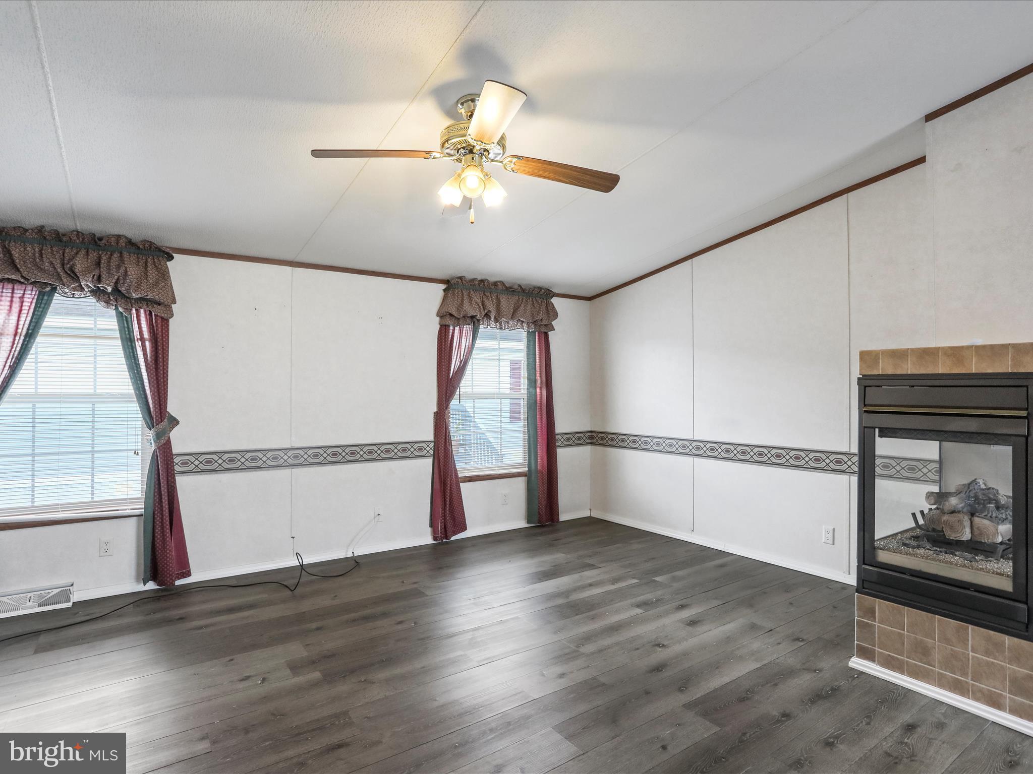 16810 Alcott Road Hagerstown, MD 21740 - Photo 15 of 34 a view of empty room with wooden floor and fan