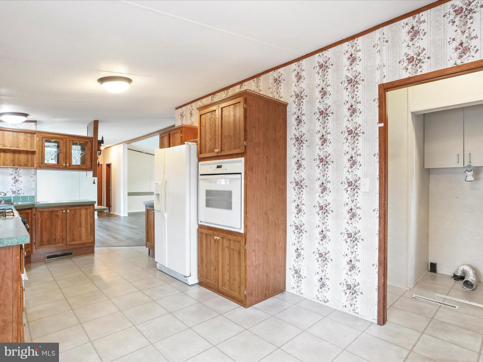 16810 Alcott Road Hagerstown, MD 21740 - Photo 6 of 34 a view of kitchen with furniture and refrigerator